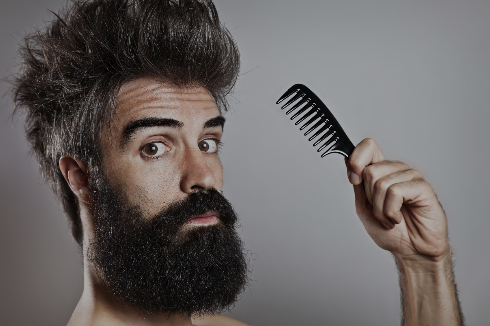 Male model editing Photoshop – beards conquer the world